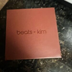 Beats x Kim Earbuds with Box, charging cable, and additional earbud size pieces